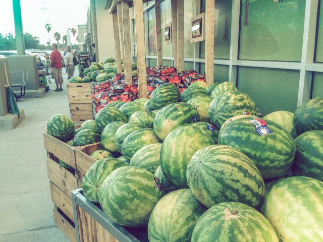 Heaps of watermelons and fresh potted plants greet you at the entrance to the new Sprouts store